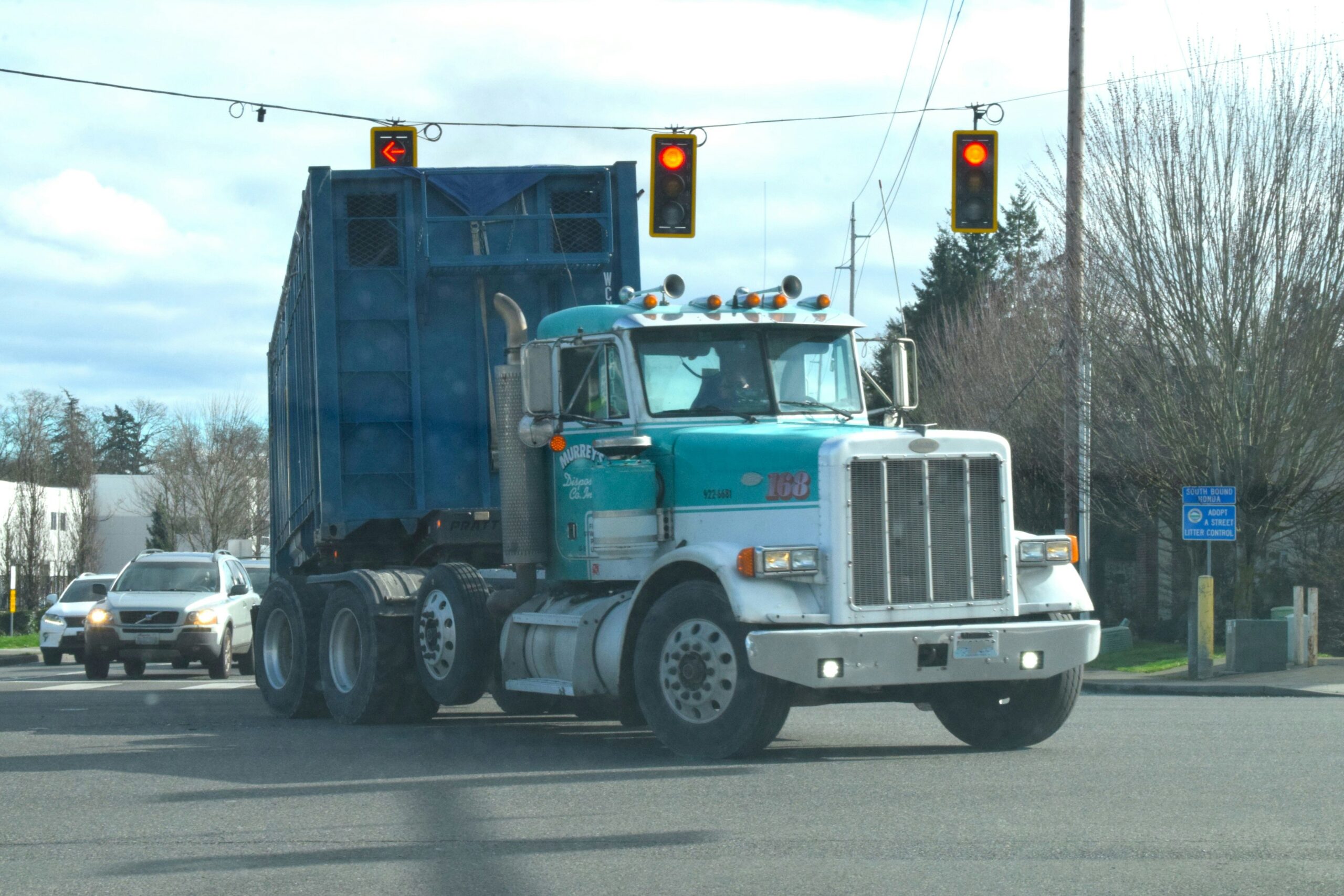teal Peterbilt semi truck at intersection — how to find direct shippers 2026