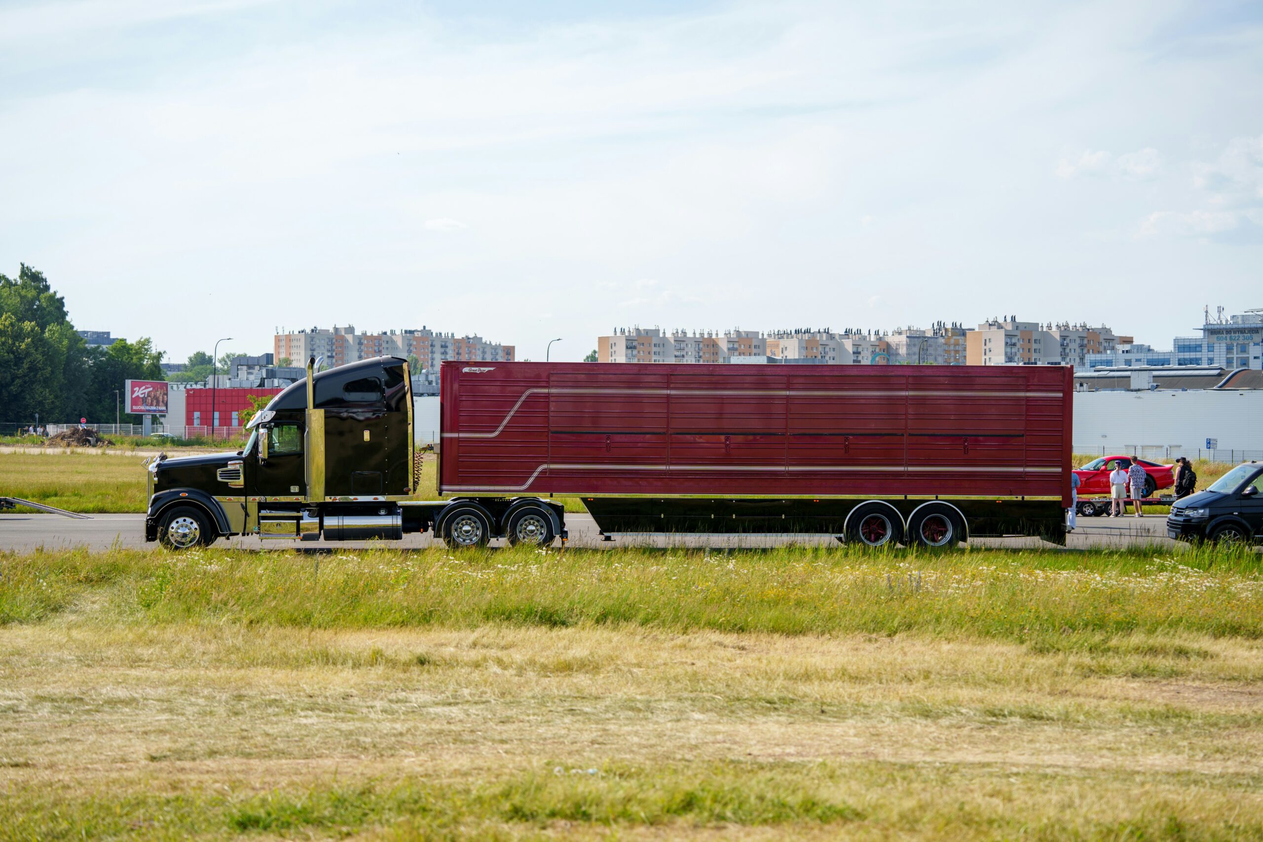 red semi truck with dry van trailer on rural highway — truck driver per diem 2026