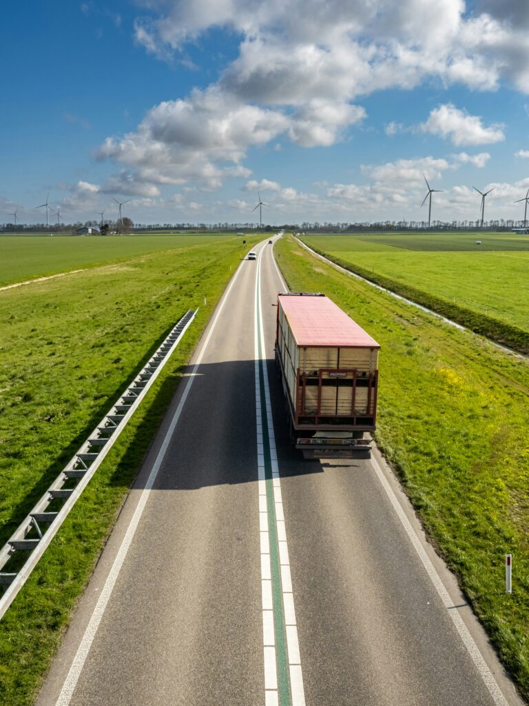 Semi truck hauling freight on open highway — how to find loads as an owner operator