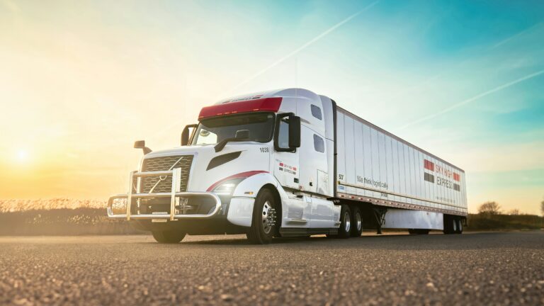 Semi-truck on the highway representing an owner-operator reviewing a rate confirmation before hauling a load